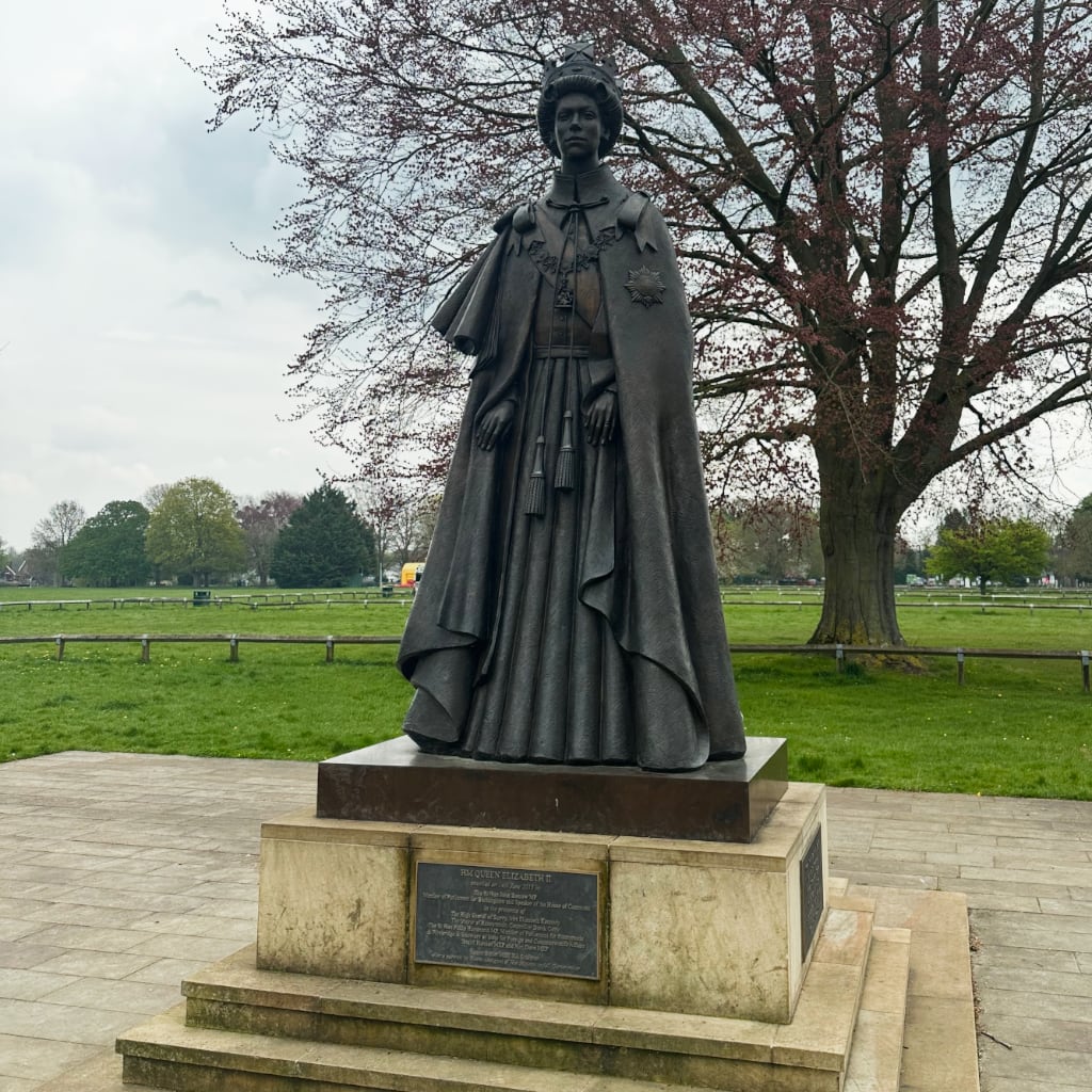 Statue of Queen Elizabeth II at Runnymede, even though I'm fairly confident she wasn't around in 1215 to watch King John sign the Magna Carta.
